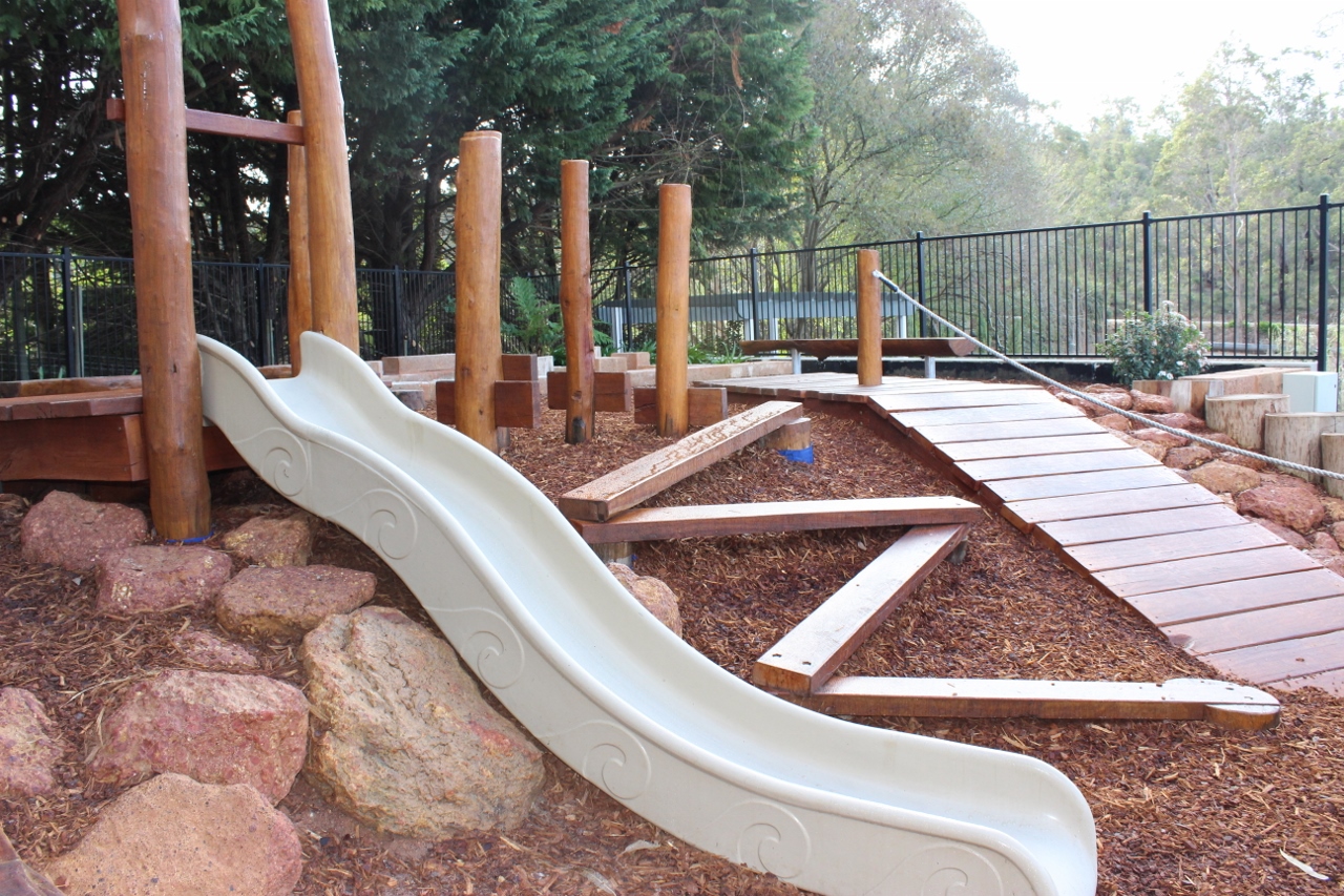 Outdoor slide and play equipment at Masonmill Gardens